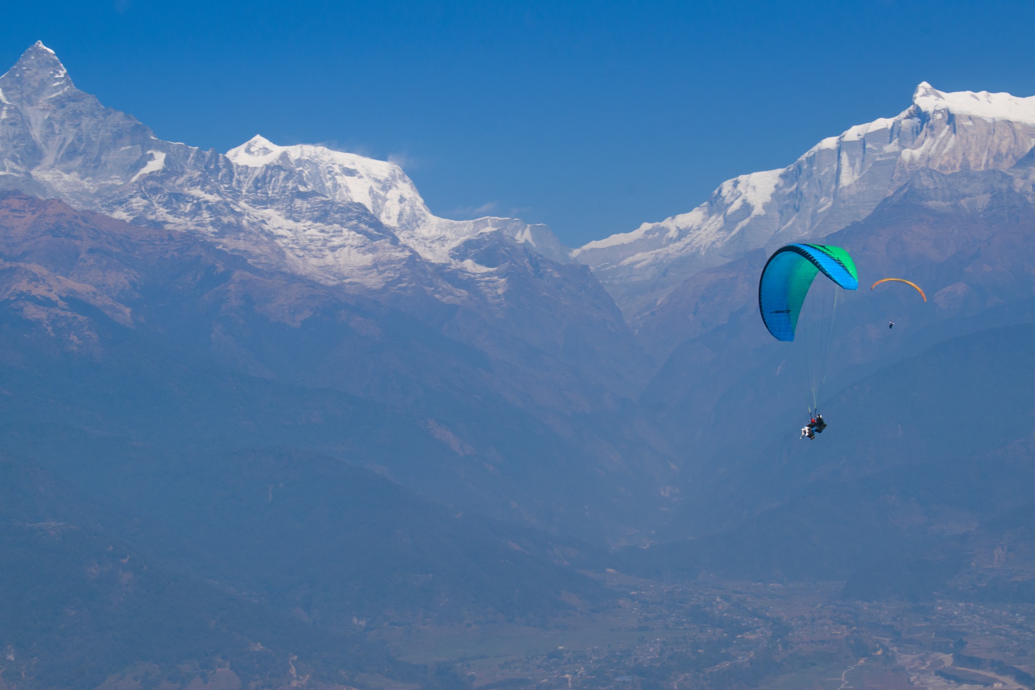 Paragliding with Himalayan mountain views